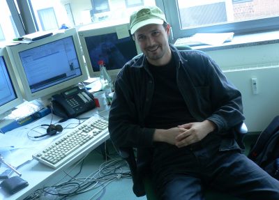 Adrian with openSUSE cap.jpeg